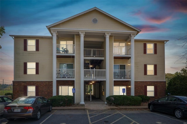 view of outdoor building at dusk