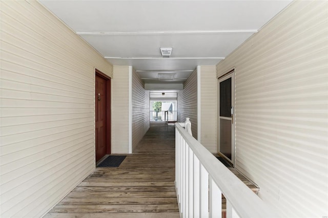 corridor featuring dark hardwood / wood-style floors