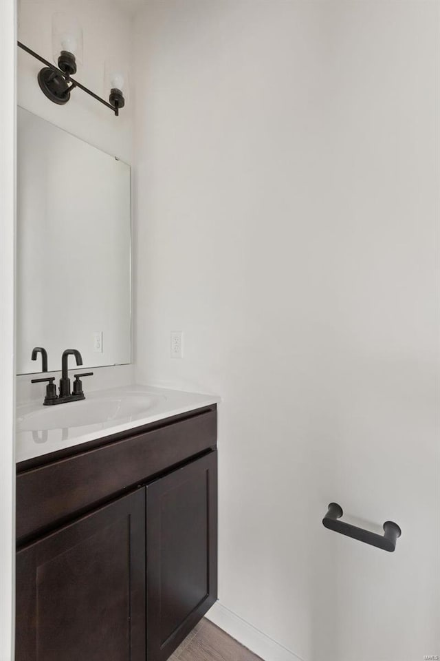 bathroom featuring vanity and wood-type flooring