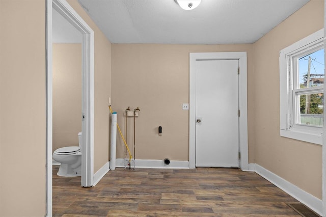 laundry room featuring dark hardwood / wood-style flooring