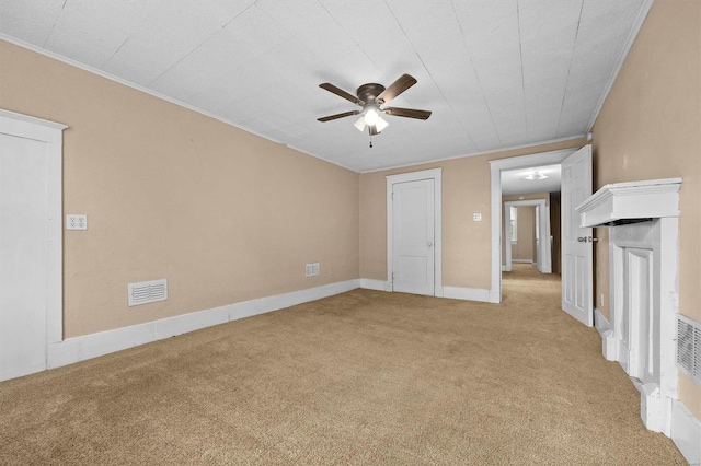 unfurnished living room with crown molding, light carpet, and ceiling fan