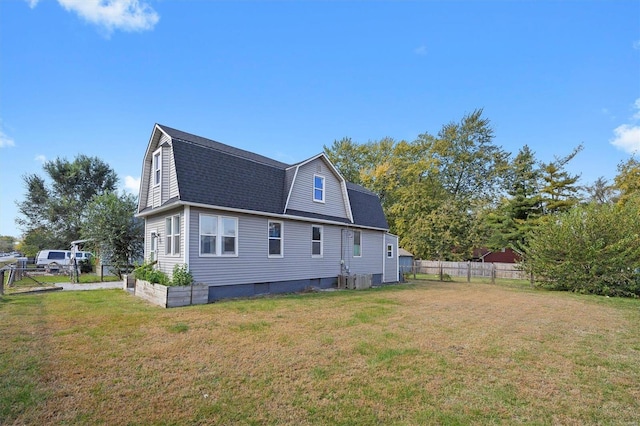 back of property featuring a lawn