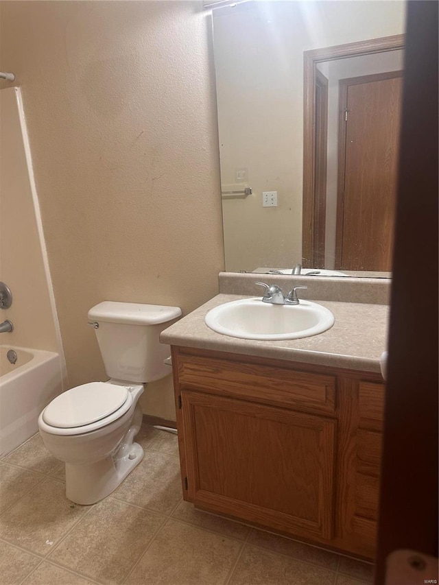 full bathroom with vanity, toilet, tile patterned floors, and shower / bathtub combination