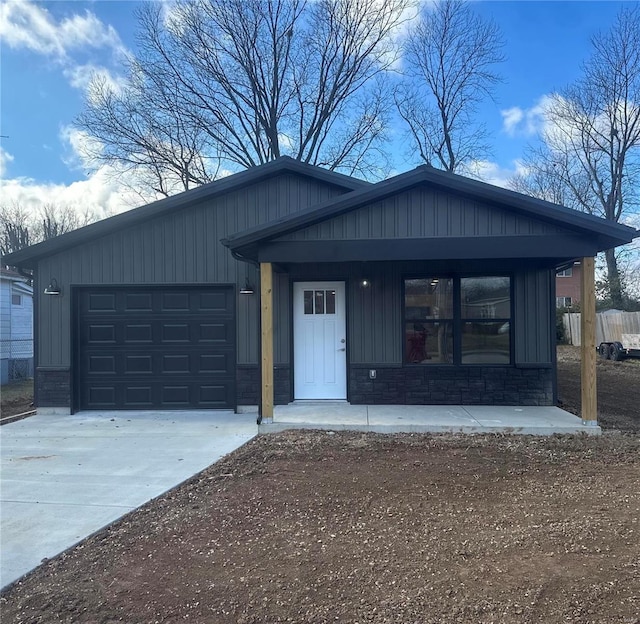 view of front of house featuring a garage and a porch