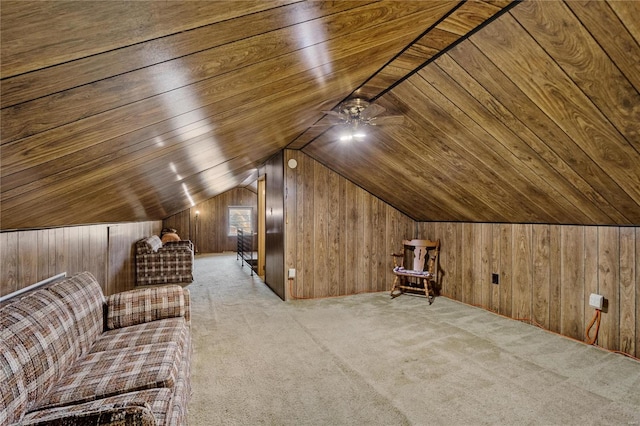 bonus room featuring wood ceiling, ceiling fan, lofted ceiling, wooden walls, and light colored carpet