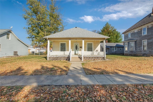 bungalow featuring a porch and a front yard