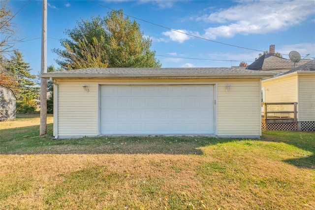 garage featuring a yard