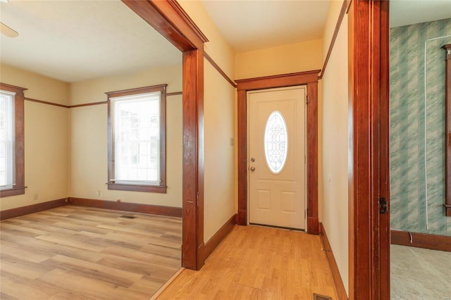 foyer entrance featuring a healthy amount of sunlight and light hardwood / wood-style flooring