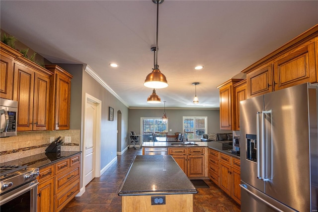 kitchen featuring a kitchen island, kitchen peninsula, backsplash, high end appliances, and decorative light fixtures