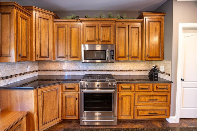 kitchen featuring tasteful backsplash and stainless steel appliances