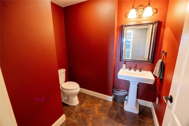 bathroom with toilet and sink