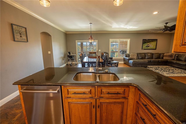 kitchen featuring dishwasher, hanging light fixtures, ornamental molding, sink, and ceiling fan