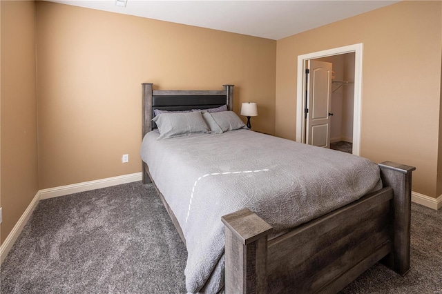 carpeted bedroom featuring a spacious closet and a closet