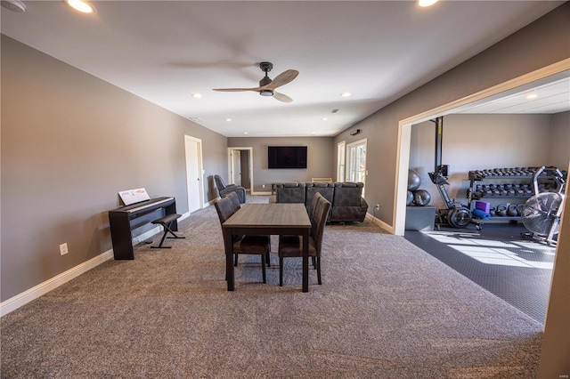 carpeted dining space featuring ceiling fan