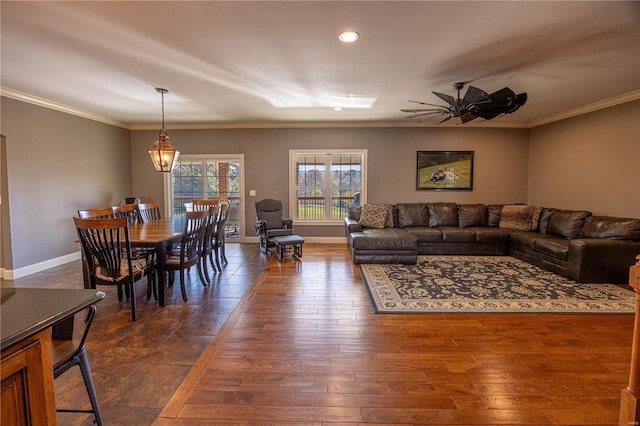 living room with ceiling fan, ornamental molding, and dark hardwood / wood-style flooring