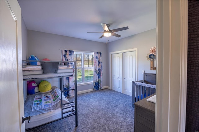 carpeted bedroom featuring a closet and ceiling fan