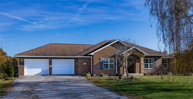 ranch-style home with a front yard and a garage