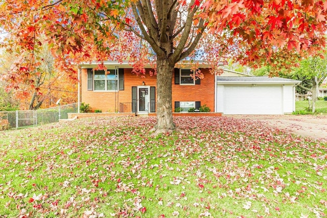 view of front of home with a garage and a front yard