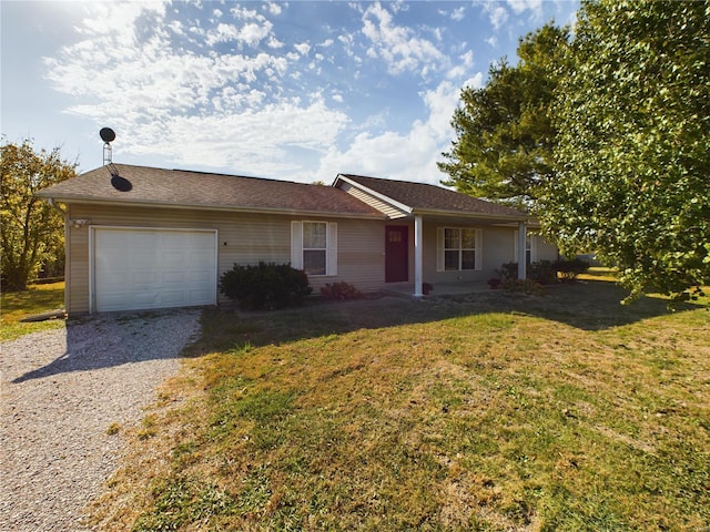 single story home with a garage and a front lawn