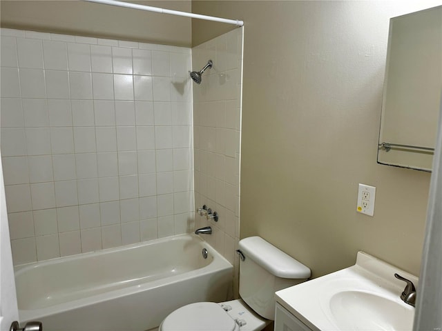 full bathroom featuring vanity, toilet, and tiled shower / bath