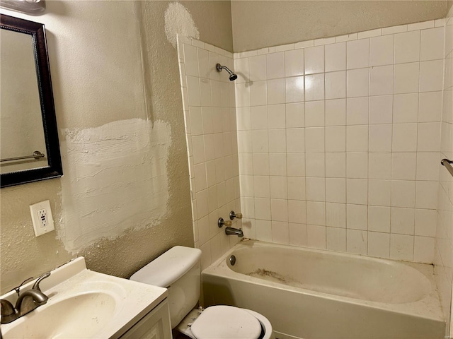 full bathroom with vanity, toilet, and tiled shower / bath combo