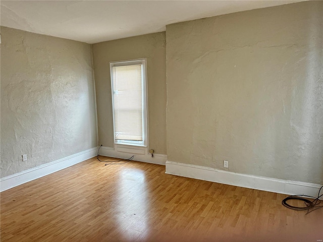 spare room featuring hardwood / wood-style floors