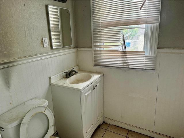 bathroom featuring vanity, toilet, and tile patterned floors