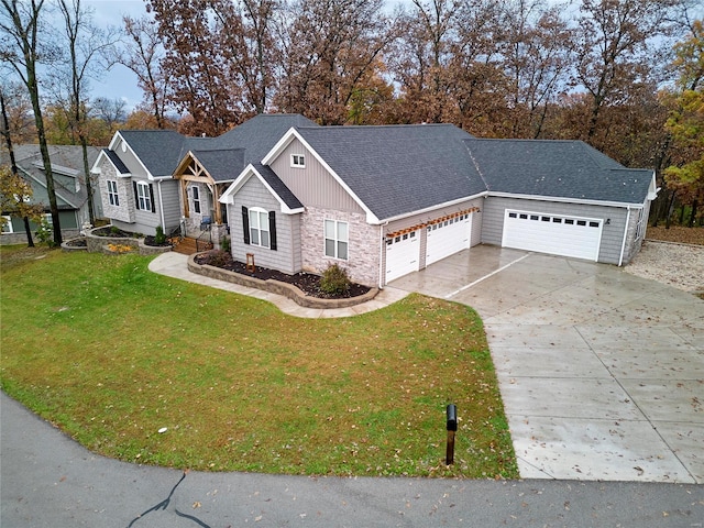 view of front of house with a front lawn and a garage