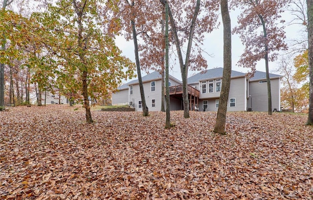 back of property featuring a deck