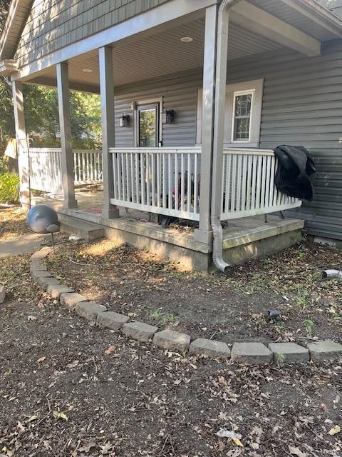 view of property exterior with a porch