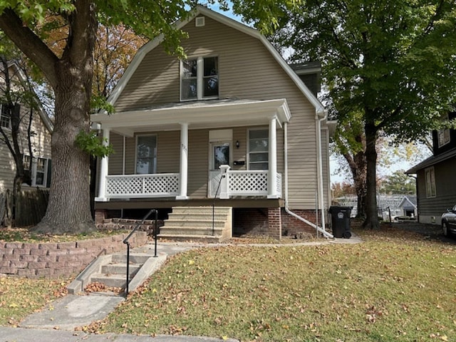 bungalow-style house with a porch and a front lawn