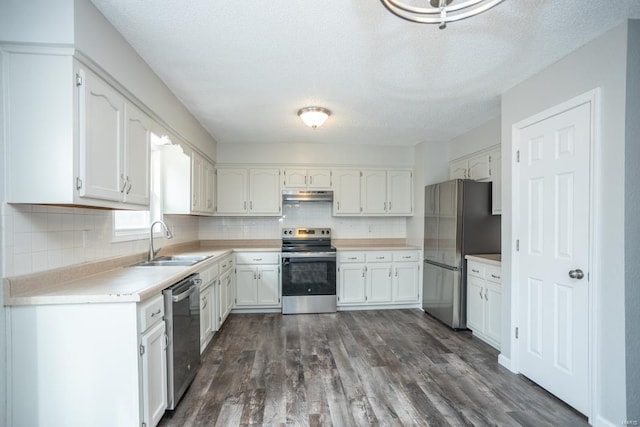 kitchen with sink, white cabinets, stainless steel appliances, and dark hardwood / wood-style flooring