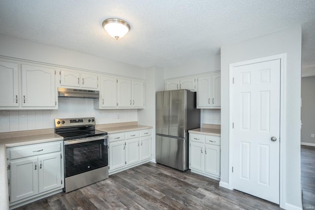 kitchen with dark wood-type flooring, white cabinetry, stainless steel appliances, and tasteful backsplash