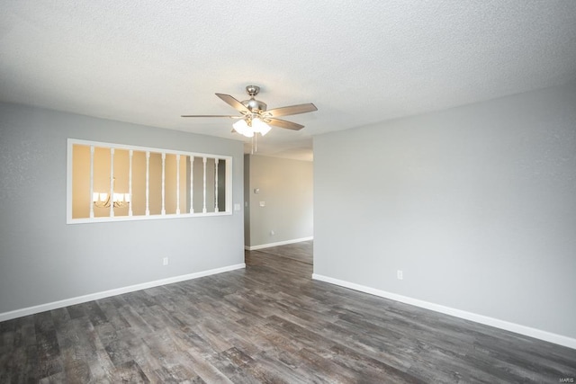 unfurnished room with ceiling fan, a textured ceiling, and dark hardwood / wood-style flooring