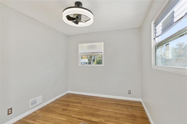 spare room with light hardwood / wood-style flooring and ceiling fan