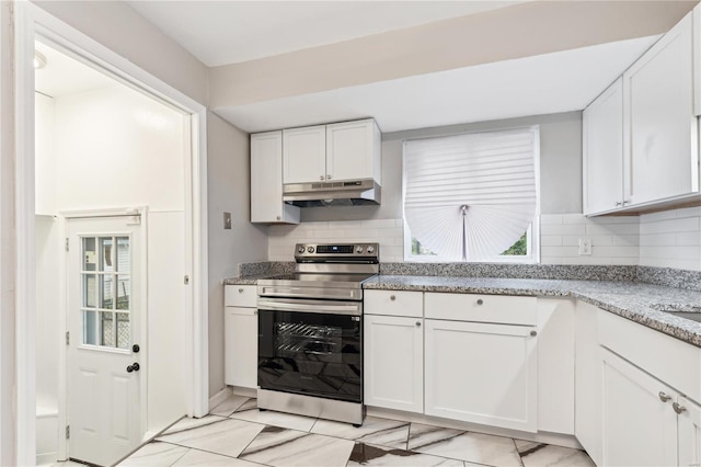 kitchen with white cabinets, stainless steel electric range, light stone counters, and decorative backsplash