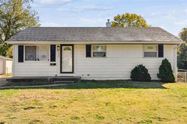 ranch-style home featuring a front yard