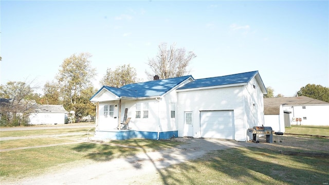 exterior space with a front lawn and a garage