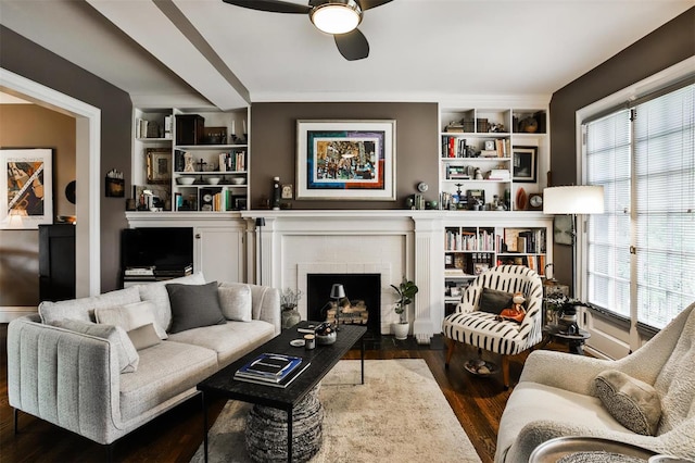 living room with ceiling fan, dark hardwood / wood-style floors, and a brick fireplace