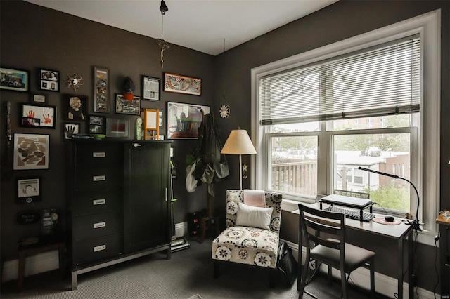 living area featuring carpet flooring and plenty of natural light