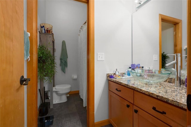 bathroom with vanity and toilet