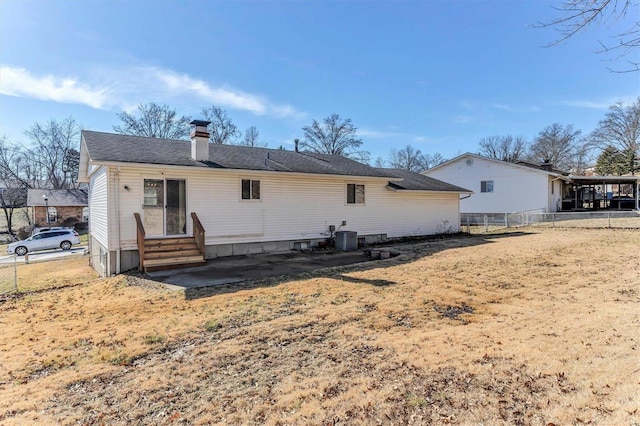 rear view of property with cooling unit