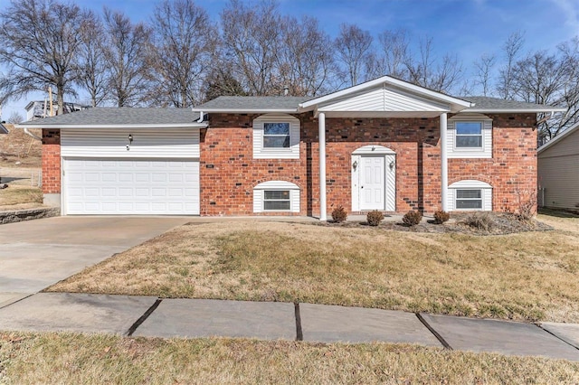 view of front of property with a garage and a front yard