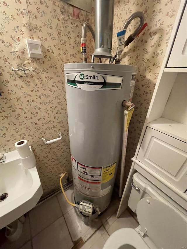 utility room featuring gas water heater