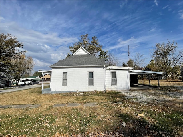 view of side of property featuring a carport