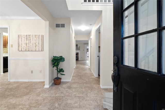 entryway with crown molding