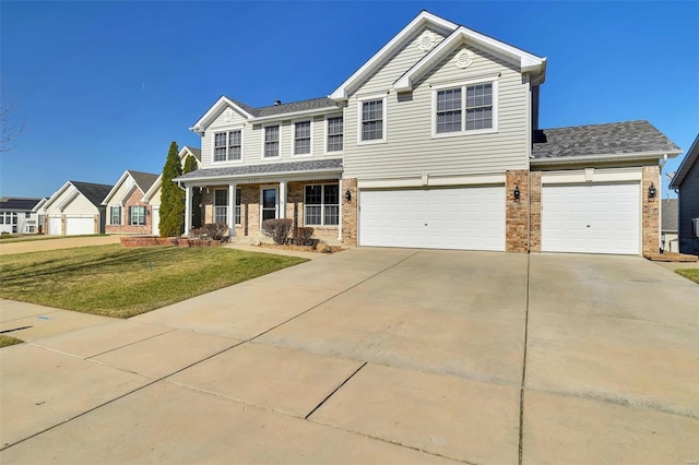 view of front facade featuring a front lawn, a porch, brick siding, and driveway