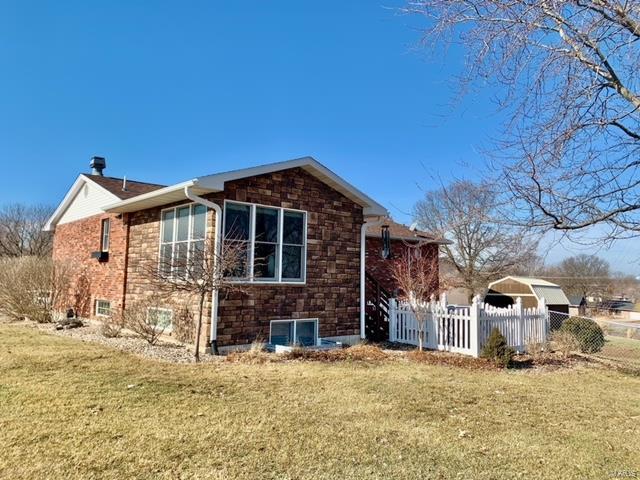 view of home's exterior with a yard