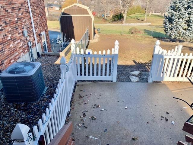 view of yard with a patio and central air condition unit