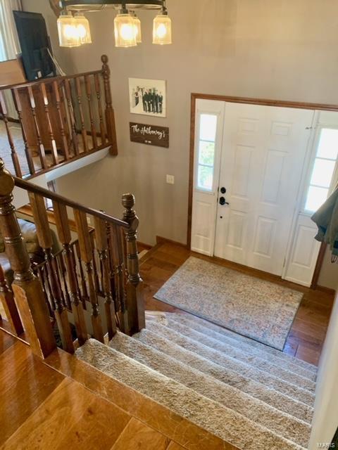 entryway with hardwood / wood-style flooring